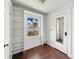 Bright bedroom with built-in shelving and large window with view to the outside at 621 N Livingston Ave, Indianapolis, IN 46222