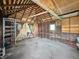 Bare garage interior with exposed beams, perfect for storage or conversion at 621 N Livingston Ave, Indianapolis, IN 46222