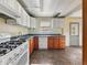 Functional kitchen featuring a gas range, ample counter space and tile flooring at 621 N Livingston Ave, Indianapolis, IN 46222