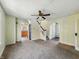 Inviting living room leading to the staircase and kitchen, filled with natural light at 621 N Livingston Ave, Indianapolis, IN 46222