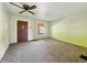 Cozy living room featuring a ceiling fan, natural light and a view of the front yard at 621 N Livingston Ave, Indianapolis, IN 46222
