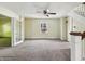Bright living room with staircase, featuring a view to the backyard through a large window at 621 N Livingston Ave, Indianapolis, IN 46222