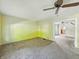 A bright living room with carpeted floors and neutral wall colors at 621 N Livingston Ave, Indianapolis, IN 46222