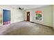 Bright living room with neutral walls, ceiling fan and a window for natural light at 621 N Livingston Ave, Indianapolis, IN 46222