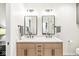 Bright bathroom features a double sink vanity with marble countertop and sleek black fixtures at 630 N College Ave # 204, Indianapolis, IN 46204
