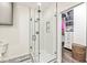 Modern bathroom features a glass enclosed shower with a niche and black and white patterned tile flooring at 630 N College Ave # 204, Indianapolis, IN 46204