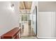 Entryway leading to living area with exposed beams at 630 N College Ave # 204, Indianapolis, IN 46204