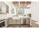 Open concept kitchen with stainless steel appliances and spacious island at 630 N College Ave # 204, Indianapolis, IN 46204