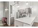 Bright kitchen with stainless steel appliances and white countertops at 630 N College Ave # 204, Indianapolis, IN 46204