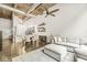 Open living space with kitchen and dining area featuring exposed ductwork and wood beams at 630 N College Ave # 204, Indianapolis, IN 46204
