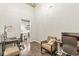 Spacious home office with hardwood flooring, neutral walls, and comfortable seating area at 630 N College Ave # 204, Indianapolis, IN 46204