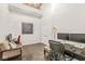 Bright home office with hardwood flooring, neutral walls, and comfortable seating area at 630 N College Ave # 204, Indianapolis, IN 46204