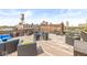 Relax in style on the roof deck featuring modern furniture and beautiful skyline views at 630 N College Ave # 204, Indianapolis, IN 46204