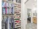 Spacious walk-in closet provides ample storage with built-in shelving for shoes and clothing at 630 N College Ave # 204, Indianapolis, IN 46204