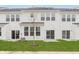 Exterior view of the backyard, showcasing the patio, lawn, and white siding at 7330 Shroyer Way, Noblesville, IN 46062