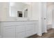 Bright bathroom showcasing a double sink vanity with white cabinets and a large mirror at 7330 Shroyer Way, Noblesville, IN 46062