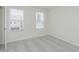 Bedroom with plush carpeting, white walls, and natural light from windows at 7330 Shroyer Way, Noblesville, IN 46062