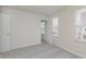 Well-lit bedroom featuring neutral walls, carpeted floors, and a large window with natural light at 7330 Shroyer Way, Noblesville, IN 46062