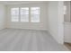 Bright bedroom featuring neutral carpet, white walls, and large windows at 7330 Shroyer Way, Noblesville, IN 46062