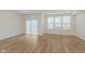 Bright living room with wood floors and a sliding door to the outside at 7330 Shroyer Way, Noblesville, IN 46062