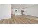 Open-concept living and kitchen area with wood floors and a bright atmosphere at 7330 Shroyer Way, Noblesville, IN 46062