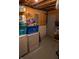 Unfinished basement area with a laundry setup, storage solutions, and ample space for customization at 7402 Broadview Dr, Indianapolis, IN 46227