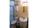 Functional bathroom featuring a shower, toilet, vanity, and mirror, designed for comfort and practicality at 7402 Broadview Dr, Indianapolis, IN 46227