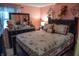 Inviting bedroom with elegant bedding, dark furniture, and soft lighting, creating a warm and restful space at 7402 Broadview Dr, Indianapolis, IN 46227