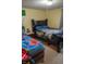 Shared bedroom with twin beds, dark furniture, and colorful bedding at 7402 Broadview Dr, Indianapolis, IN 46227