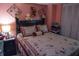 Comfortable bedroom featuring stylish bedding, furniture, soft lighting, and decor, creating an inviting personal space at 7402 Broadview Dr, Indianapolis, IN 46227
