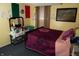 Bedroom with a full-sized bed, full mirror, tiger art and colorful decorations at 7402 Broadview Dr, Indianapolis, IN 46227
