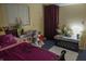 Comfortable bedroom with a full-sized bed, plush decor, and cozy natural lighting at 7402 Broadview Dr, Indianapolis, IN 46227
