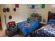 Bright room with a bed, toys, decorated walls, and colorful bedding for a playful atmosphere at 7402 Broadview Dr, Indianapolis, IN 46227