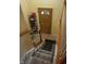 View from stairway to front door with decorative glass and shoe rack at 7402 Broadview Dr, Indianapolis, IN 46227