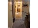 A well-lit hallway with carpeted floors leading to various rooms, creating a seamless flow throughout the home at 7402 Broadview Dr, Indianapolis, IN 46227