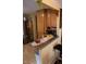 Charming kitchen with stainless steel refrigerator and microwave, and breakfast bar seating at 7402 Broadview Dr, Indianapolis, IN 46227