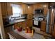 Bright eat-in kitchen featuring stainless steel appliances, ample counter space, and built-in microwave at 7402 Broadview Dr, Indianapolis, IN 46227