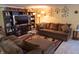 Cozy living room with plush brown sectional, decorative accents, and ample natural light at 7402 Broadview Dr, Indianapolis, IN 46227