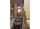 Carpeted stairway leads from one level to another with view into the kitchen at 7402 Broadview Dr, Indianapolis, IN 46227