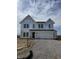 New two-story home under construction featuring a two-car garage and modern architectural details at 741 Oakleaf Dr, Greenfield, IN 46140