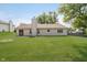 Expansive backyard features a patio and plenty of green space, perfect for outdoor activities at 7418 Southern Lakes Dr, Indianapolis, IN 46237
