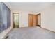 Bedroom featuring carpet, trim and multiple doors at 7418 Southern Lakes Dr, Indianapolis, IN 46237