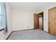 Bedroom featuring carpet, trim and window at 7418 Southern Lakes Dr, Indianapolis, IN 46237
