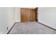 Bedroom featuring carpeting, trim and closet at 7418 Southern Lakes Dr, Indianapolis, IN 46237