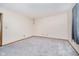 Bedroom featuring carpet, trim and window with curtains at 7418 Southern Lakes Dr, Indianapolis, IN 46237