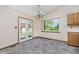 Bright dining room with backyard view from the double patio doors at 7418 Southern Lakes Dr, Indianapolis, IN 46237