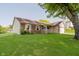 Beautiful home exterior featuring a well-manicured lawn and lovely front porch at 7418 Southern Lakes Dr, Indianapolis, IN 46237