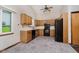 Kitchen with oak cabinets and black appliances at 7418 Southern Lakes Dr, Indianapolis, IN 46237