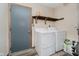 Main floor laundry room featuring washer, dryer and shelving at 7418 Southern Lakes Dr, Indianapolis, IN 46237