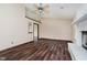 Bright living room with wood-look floors and a vaulted ceiling at 7418 Southern Lakes Dr, Indianapolis, IN 46237